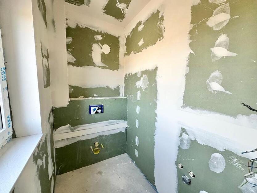 Rastede - Im Göhlen: Neubau-Reihenendhaus mit Einbauküche als Erstbezug zimmer