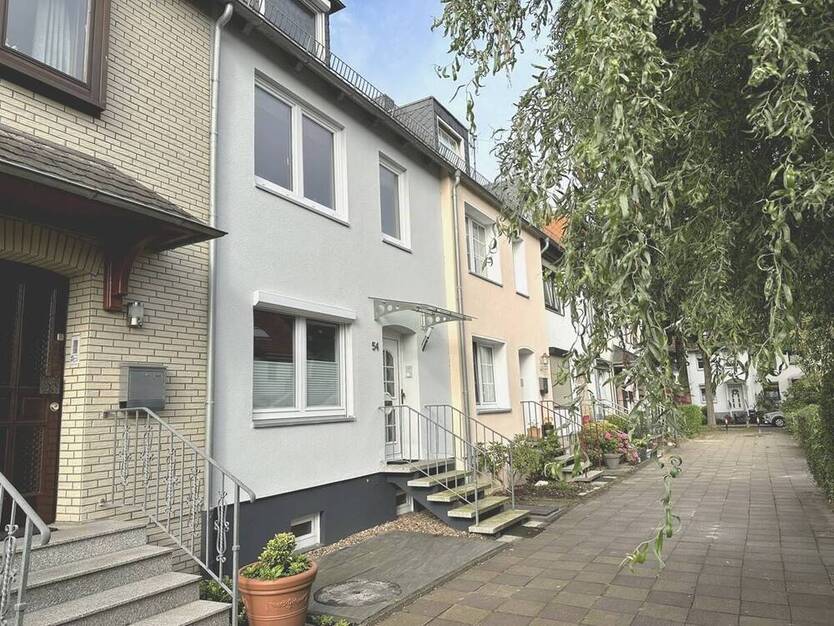 PURNHAGEN-ImmobilieN - Gepflegtes Reihenmittelhaus mit Garten in ruhiger Sackgassenlage von Aumund